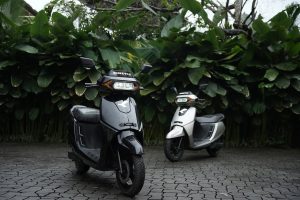 Kinetic electric scooter rider following EV monsoon safety tips